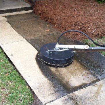 Surface cleaning a walkway, removing grime.