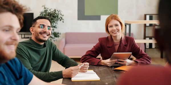 Colleagues having a friendly meeting around a table.