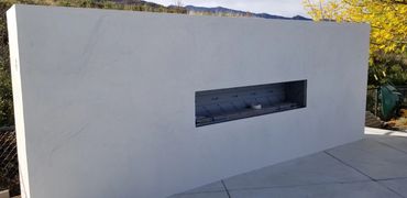 Modern Outdoor Concrete Plaster Fireplace - Kelowna BC - Custom project created by MODE Artisans