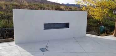 Modern Outdoor Concrete Plaster Fireplace - Kelowna BC - Custom project created by MODE Artisans