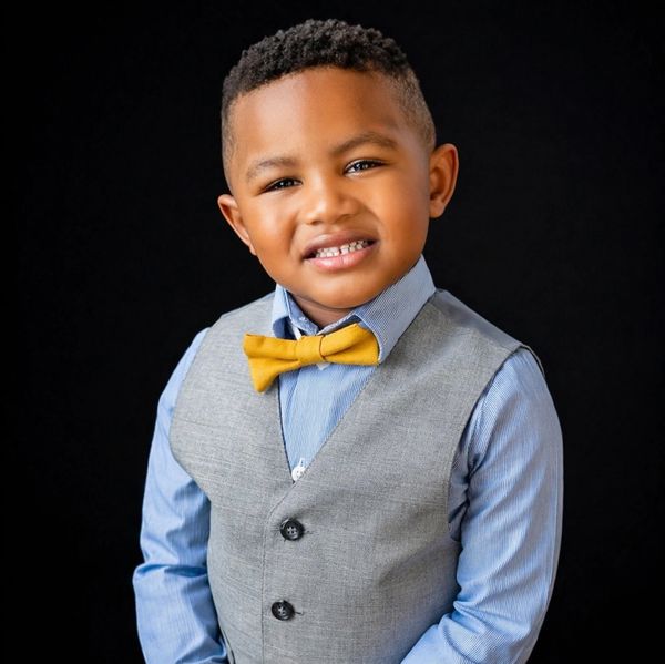 Smiling boy in a suit