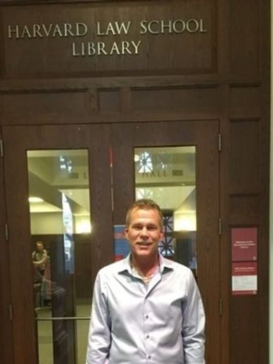 Chad St. Aiden outside the doors of Harvard University Law Library. Boston MA, USA