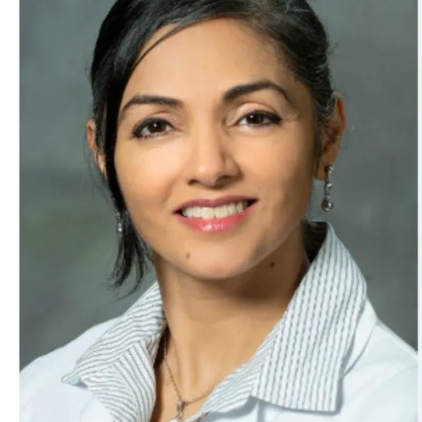Professional portrait of a woman in a lab coat.