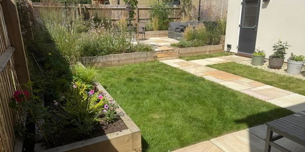 Turfing, path, patio and raised planters installed by TEC Landscaping in Malmesbury