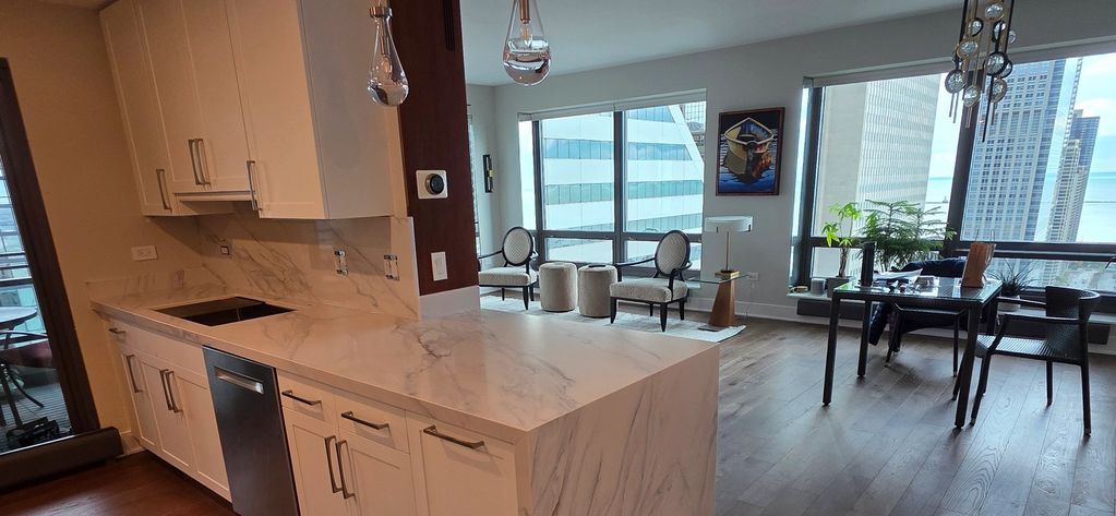 Calacatta Lapiza quartz countertops, beautifully crafted with a 2" mitered edge and a waterfall desi