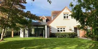 Sandy Lane side extension and kitchen project, detached house seen from the garden