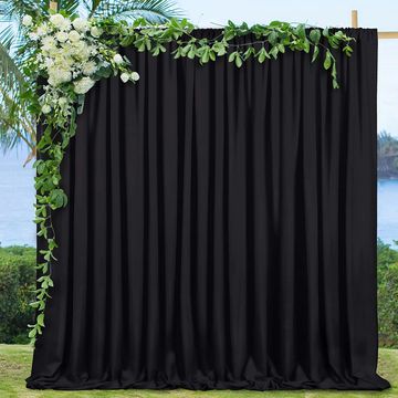 Black curtained photographers backdrop