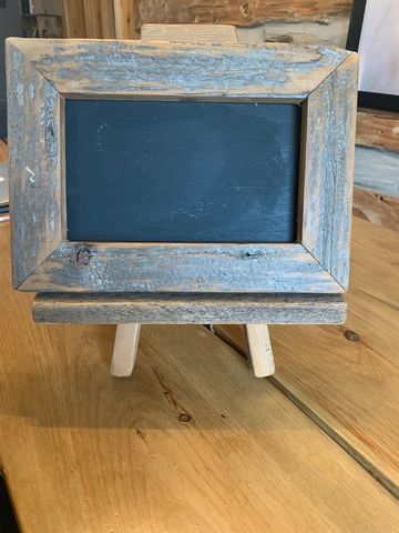 Wooden framed black board on small easel