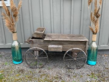 Rustic  barn wood  wagon with blue glass vases