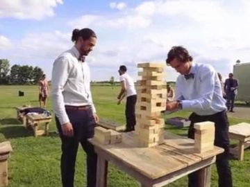 People playing giant jenga