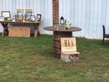 Round top with whiskey barrel base for people to gather around