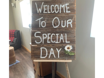 Rustic wooden Welcome to our Special day sign on a wooden easel