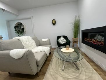 Scandinavian-style living room with stunning electric log effect fire for a cosy night in