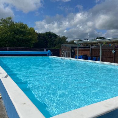 Outdoor swimming pool on a sunny day.