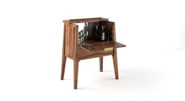 Wooden mid-century modern bar cabinet with fold-down door and liquor bottles inside.