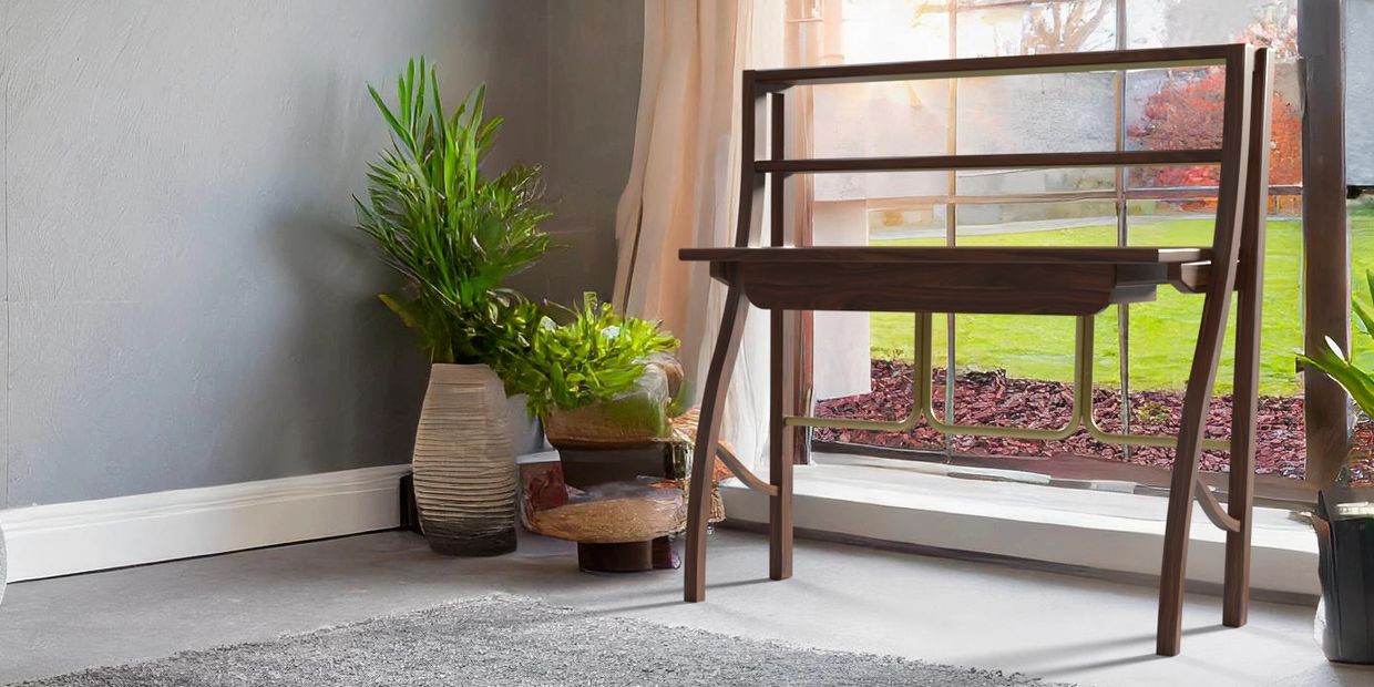 Wooden desk near a window with potted plants.