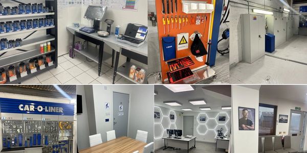 Modern automotive workshop with organized tools, safety kits, and clean office spaces.