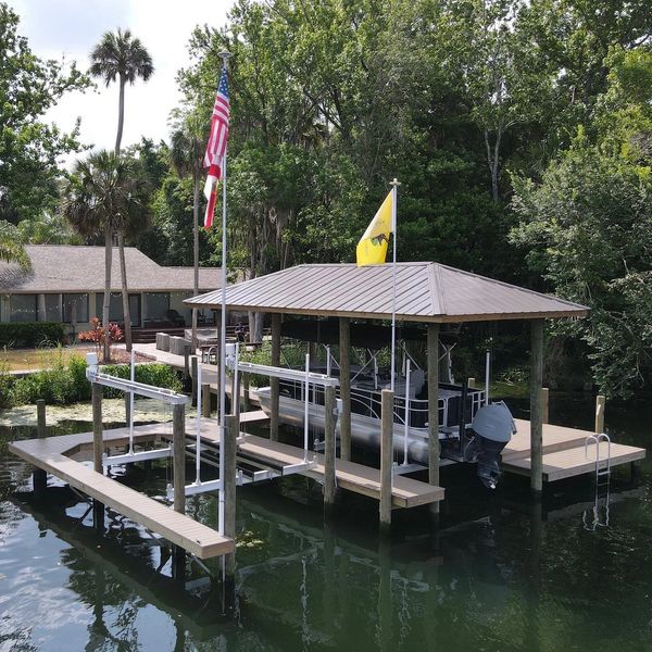 Boathouse with main dock, finger piers and two boatlifts built in Homosassa