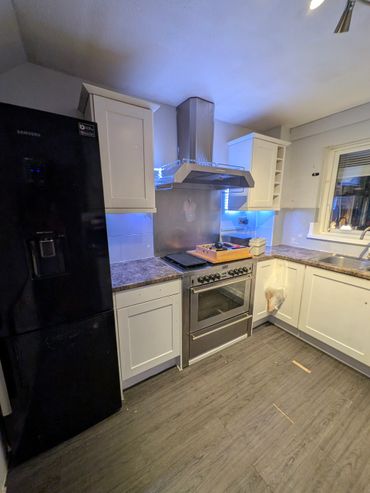 existing kitchen before refurbishment and new howdens kitchen being installed. 