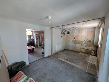 partition wall removed, ceiling plastered and bonded. 