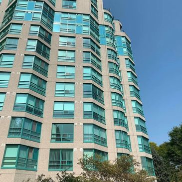 High-rise caulking commercial buildings.  sealing, waterproofing, modern building, glazing,  