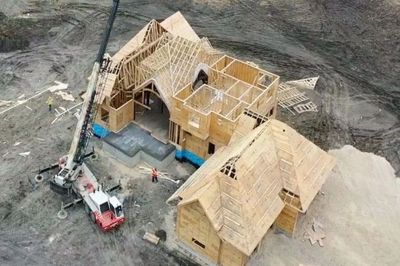 Custom home at the framing stage of construction.