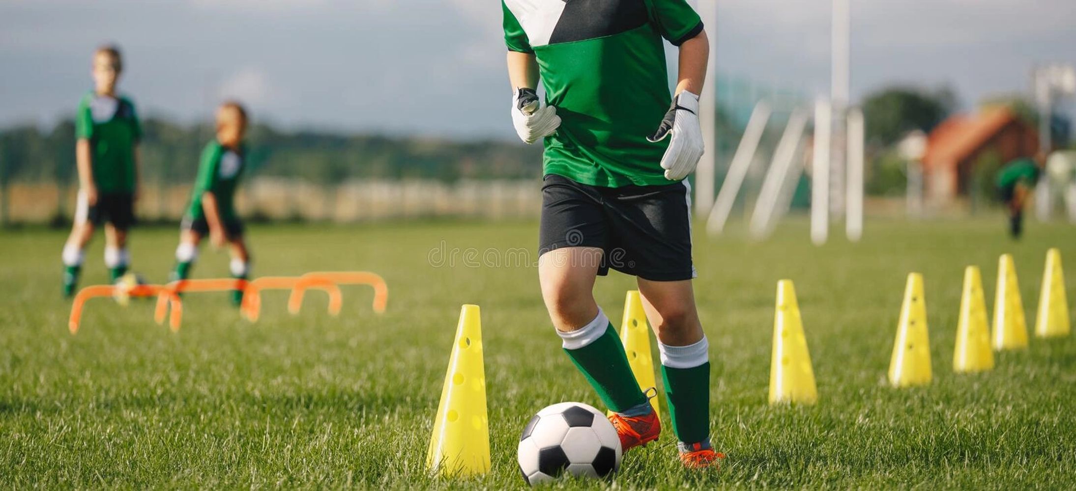 Close up of a kid playging soccer.