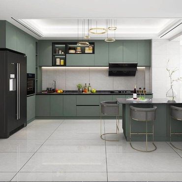 Modern kitchen with green cabinets and gray countertops.