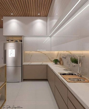 Modern kitchen with sleek cabinetry and marble countertops.