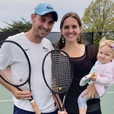 Coach Paul Braude with his wife and daughter holding tennis racquets