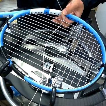 Restringing tennis racquet