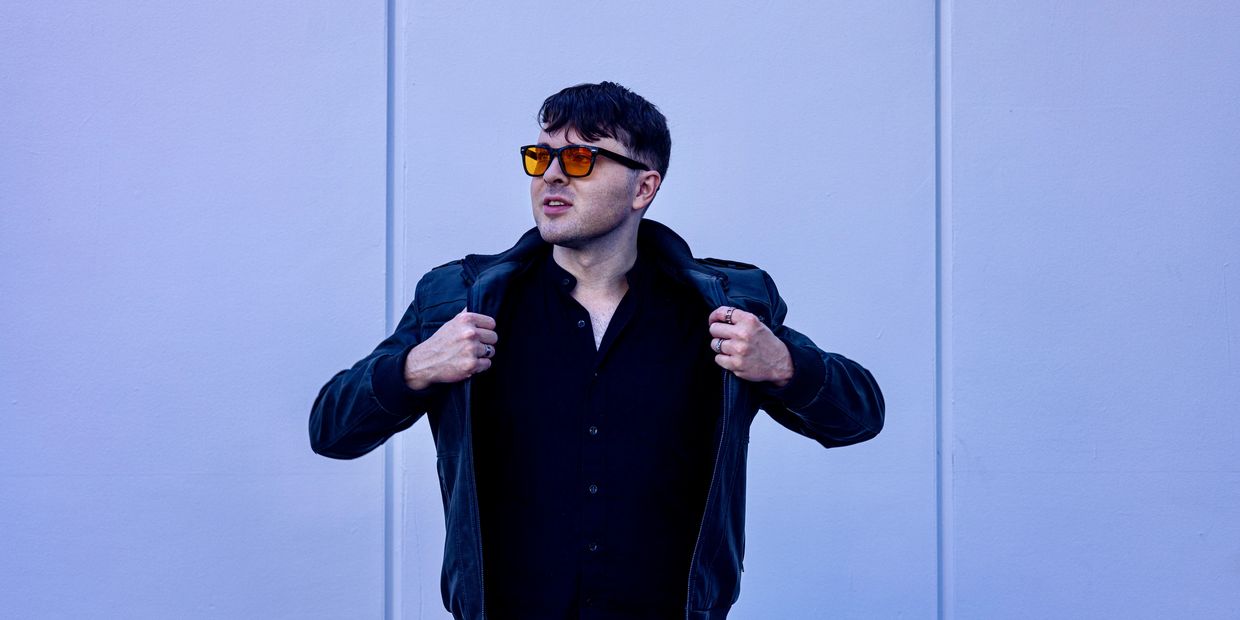 kyle ray orange glasses leather jacket