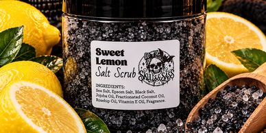 Sweet Lemon Salt Scrub jar surrounded by lemons.