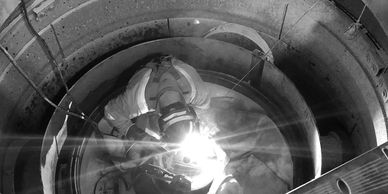 Millwright inside crusher completing repairs