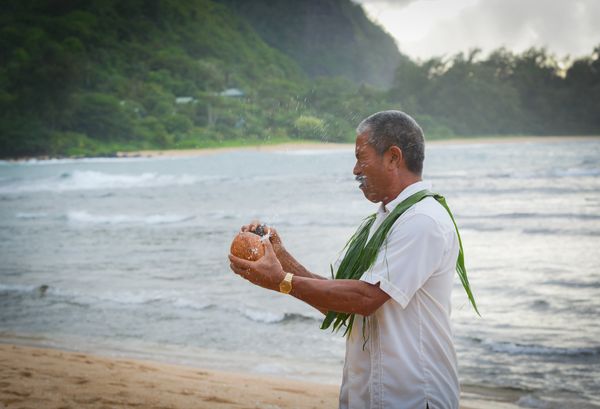Kelvin Ho Hawaiian minister Alohana Kauai Weddings Coconut breaking water sharing