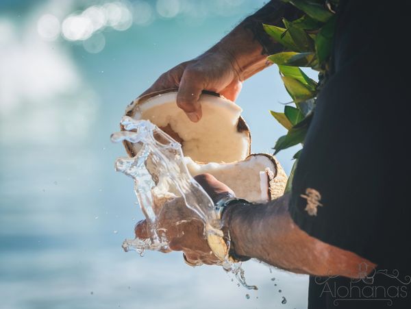 Coconut breaking water sharing ceremony