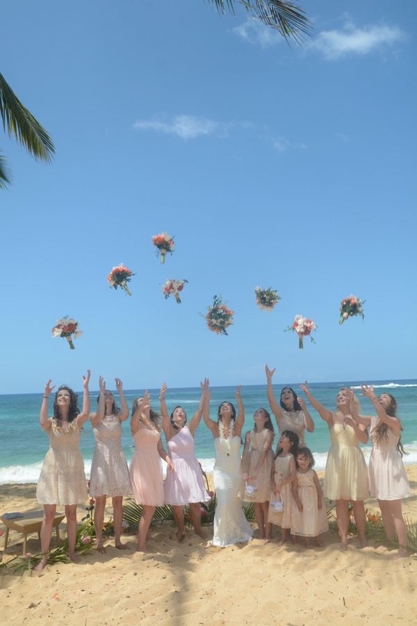 Poipu beach kauai beach wedding brides maids bouquet toss