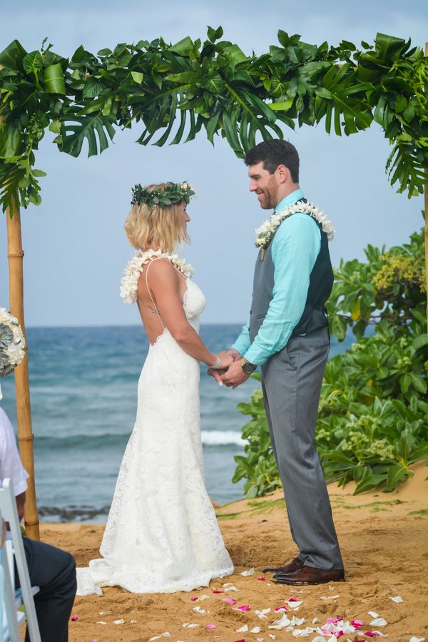 Hawaiian wedding monstera leaves bamboo arch wedding inspiration