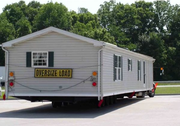Transporting a single-wide manufactured home in North Louisiana.
