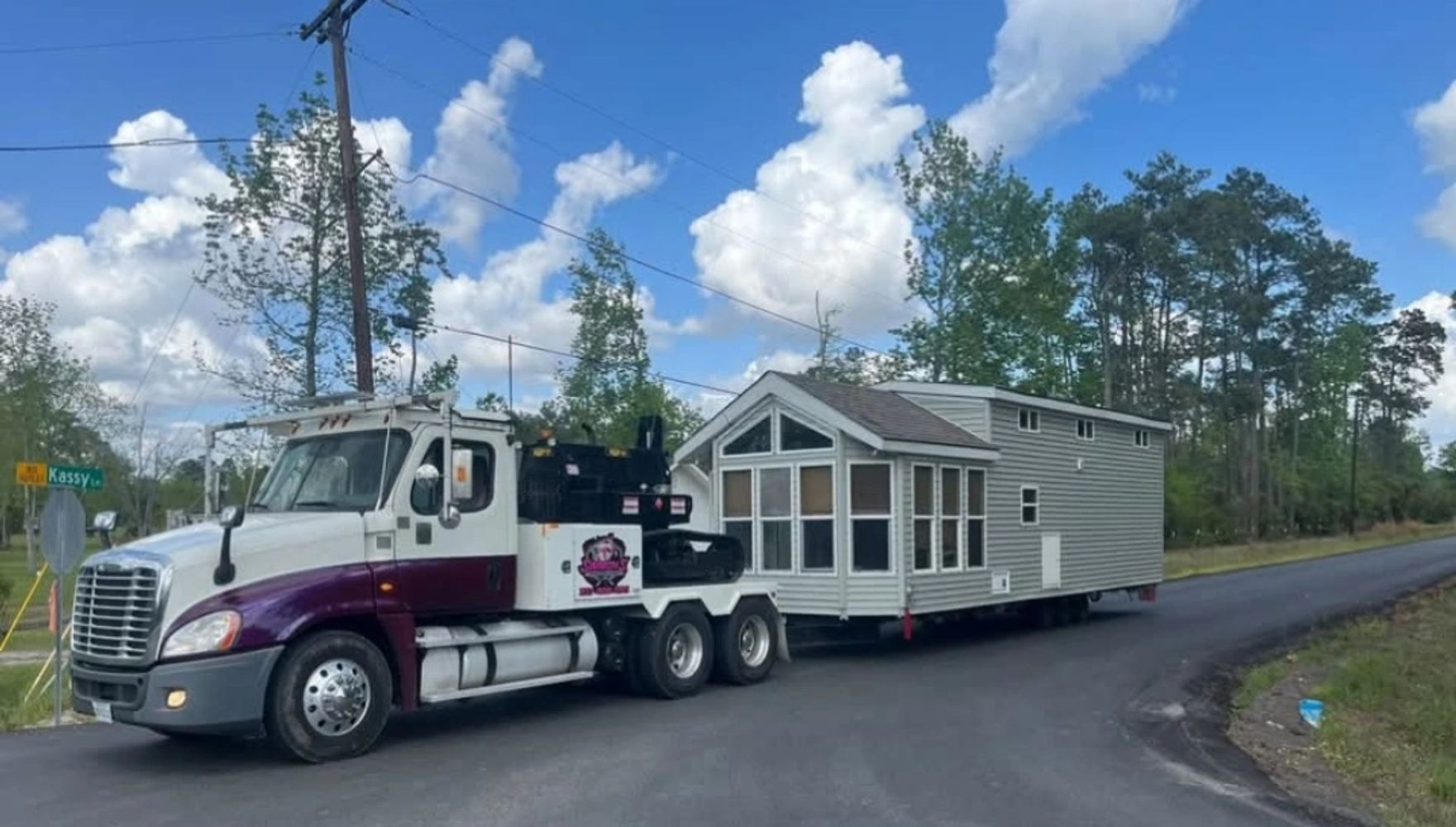 Simmons Mobile Home Movers transporting a tiny home