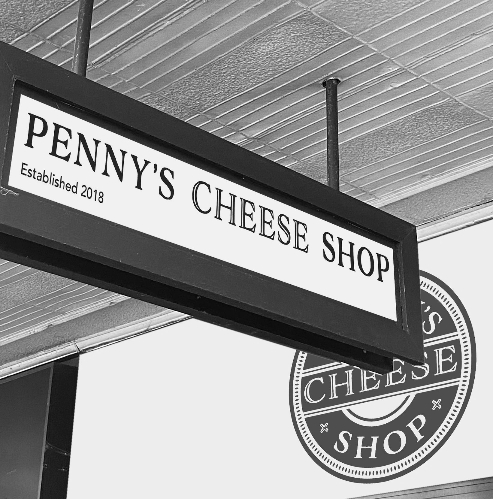 Picture of sign for Penny's Cheese Shop on Macleay Street