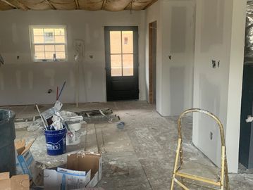 Room under construction with construction materials scattered.