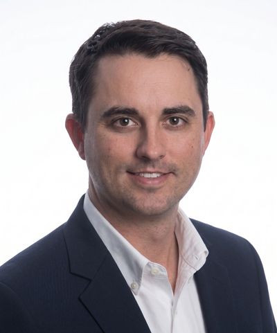Professional portrait of a man in a suit.