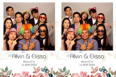 Group of friends posing joyfully with colorful accessories at Alvin and Elissa's wedding.