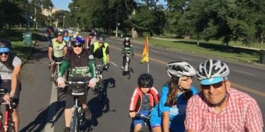 Group of adults and children riding bicycles