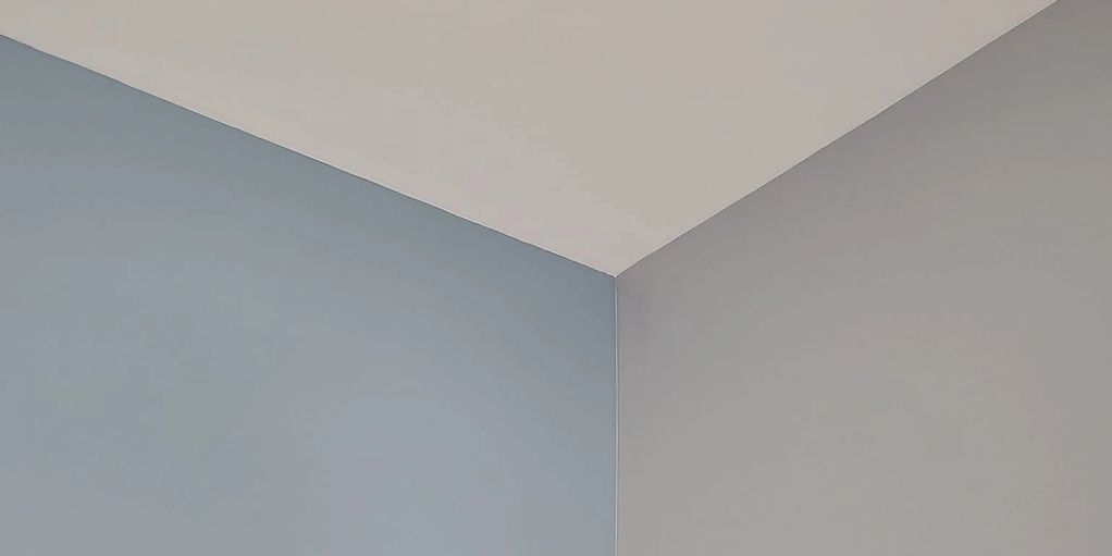 Corner of a room with blue and gray walls.