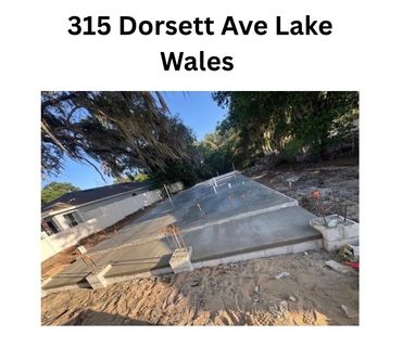 Concrete foundation slab freshly poured at 315 Dorsett Ave Lake Wales.