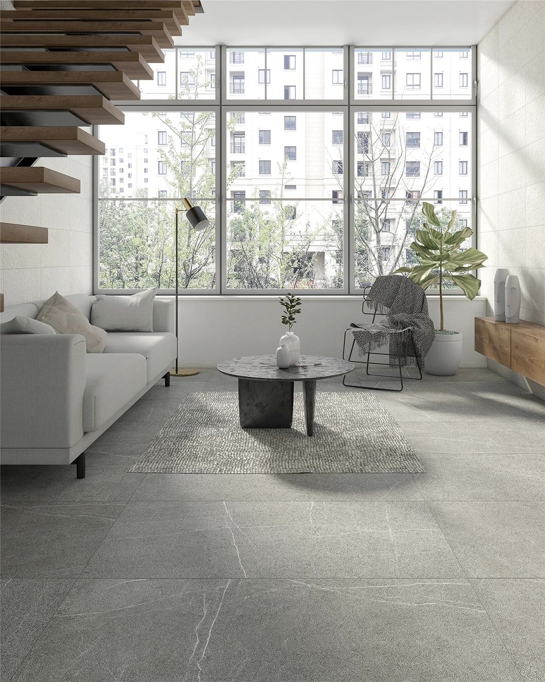 Martel Gray tile 24in by 48in porcelain rectified tile grey tones & white veins in a living room