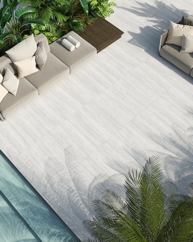 Caravita Platino tile 24in by 48in porcelain rectified tile with grey tones and white veins on patio