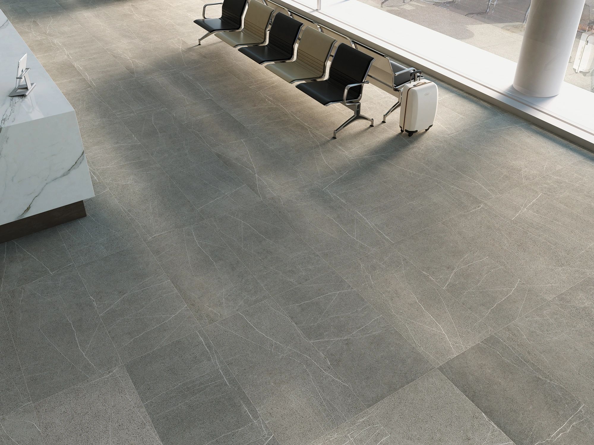 Martel Gray tile 24in by 48in porcelain rectified tile with grey tones and white veins at an airport